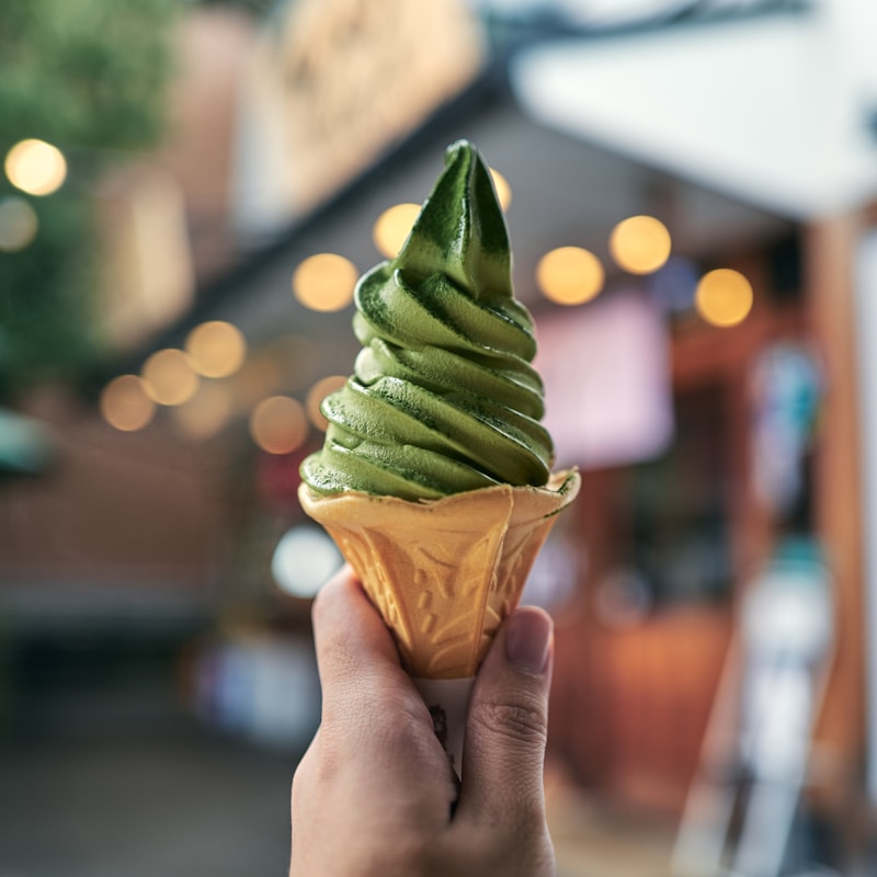 Green gelato cone in hand, placeholder image