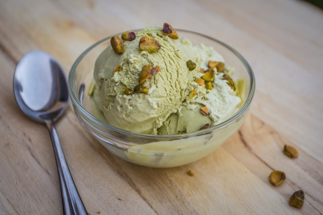 Pistachio gelato served in a clear glass bowl