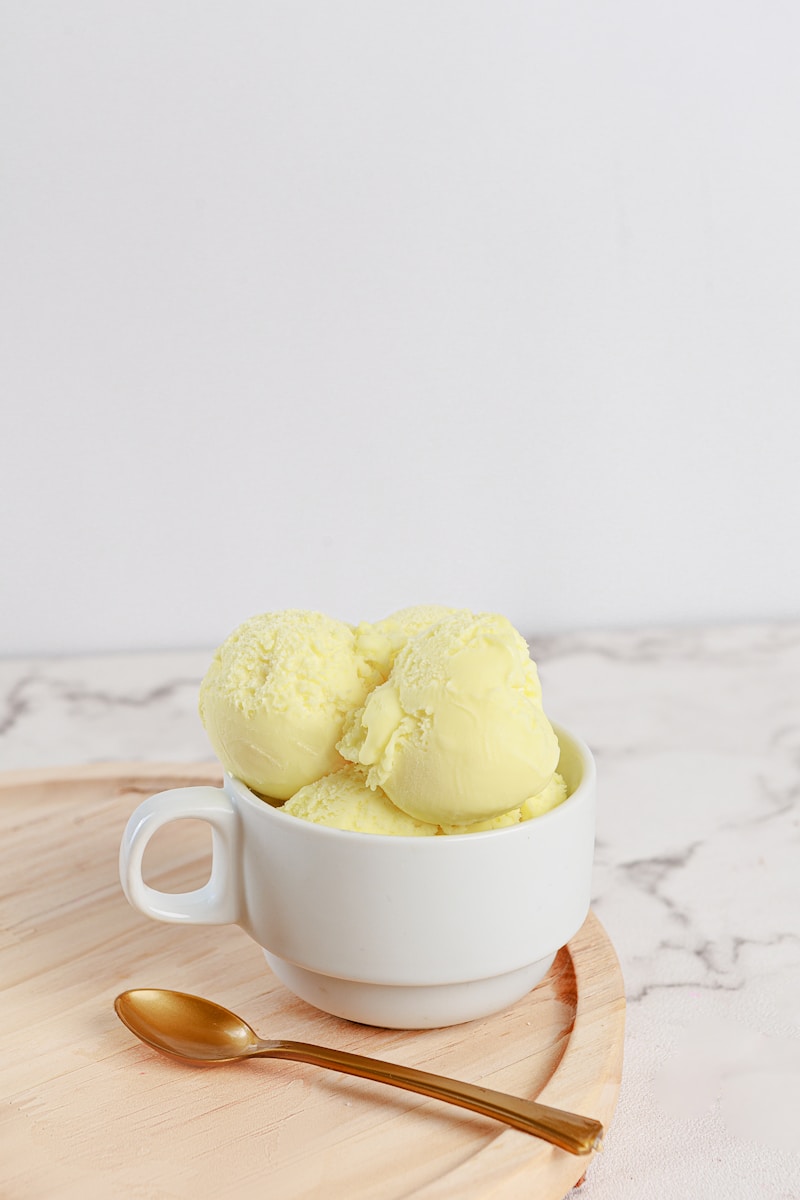 Two bright scoops of sorbet in a white bowl